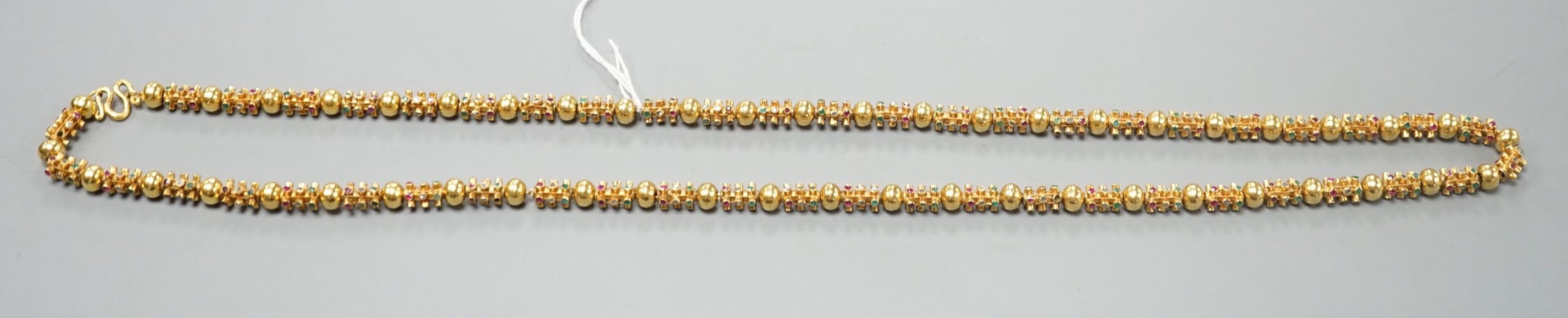 A modern Thai yellow metal and multi gem set necklace, 70cm, gross weight 55.1 grams.